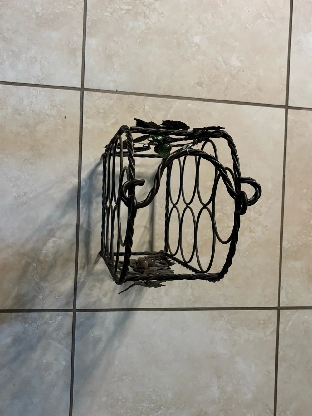 Black Metal Wine Bottle Rack with Decorative Leaf Accents